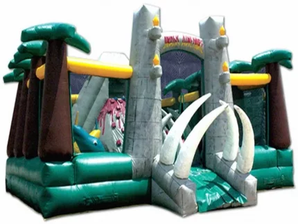 Dinosaur-themed inflatable jumping castle with jungle design and giant tusks, perfect for kids' events. Buy affordable, high-quality online in South Africa.