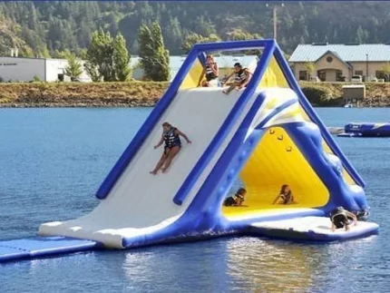 Inflatable water slide with climbing wall and platform, perfect for lake adventures and group fun. Buy durable, high-quality options online in South Africa.