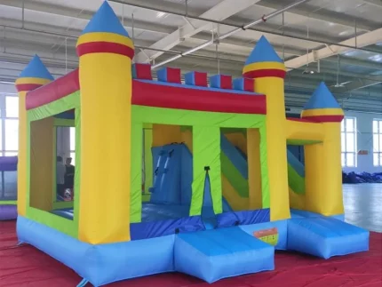 Large colorful castle-themed inflatable jumping castle with slide and climbing wall, perfect for events. Buy high-quality, affordable options online in South Africa.